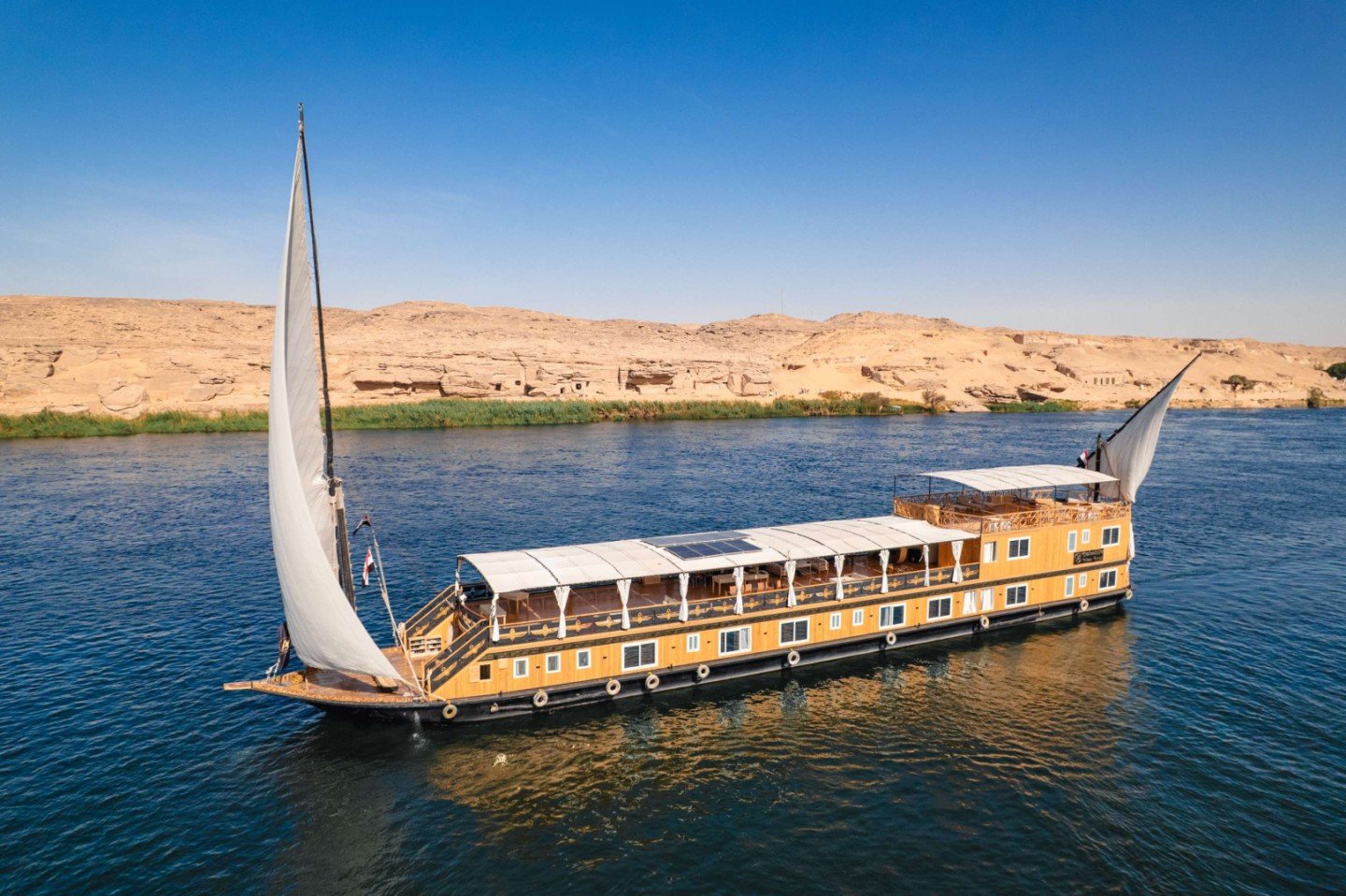 Traditional Dahabiya sailing privately on the Nile