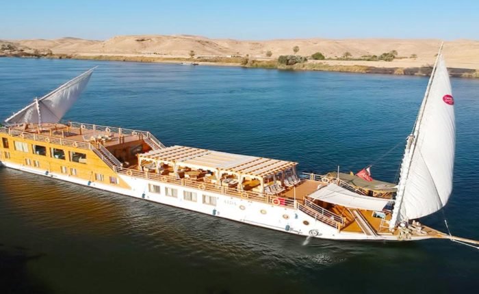 Dahabiya cruising through Nile scenery